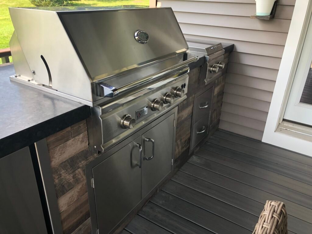 Built-in grill of outdoor kitchen shining like new after receiving our services