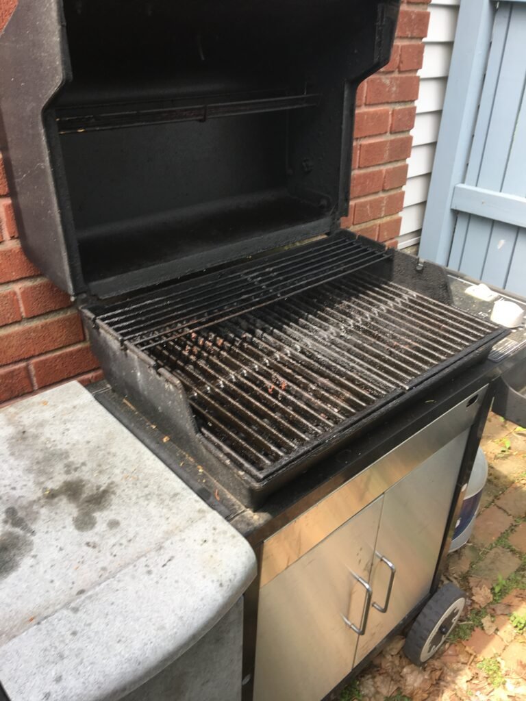 Dirty gas grill grate prior to cleaning